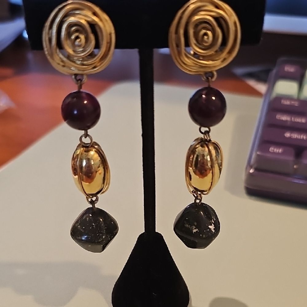 Gold and Purple Dangling Earrings with Spiral Design